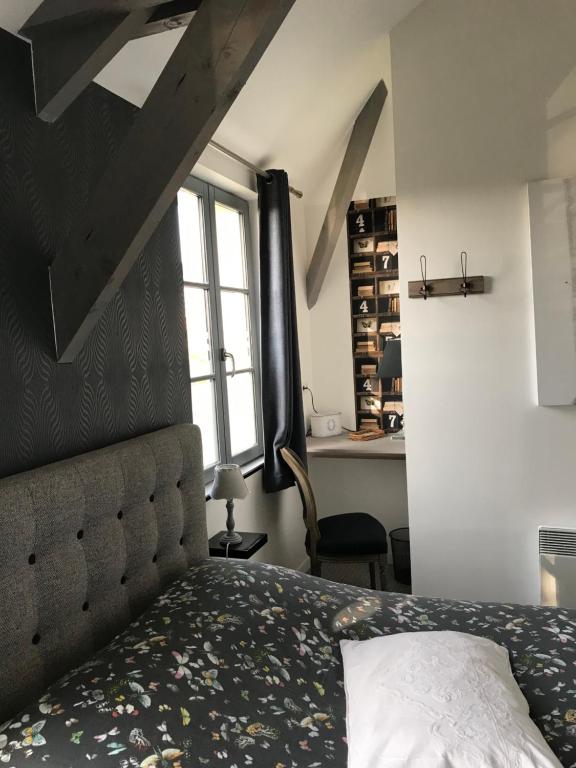 Postel nebo postele na pokoji v ubytování O Mylle Douceurs