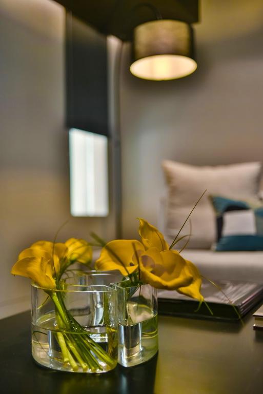 Posteľ alebo postele v izbe v ubytovaní Athens Dom Hotel