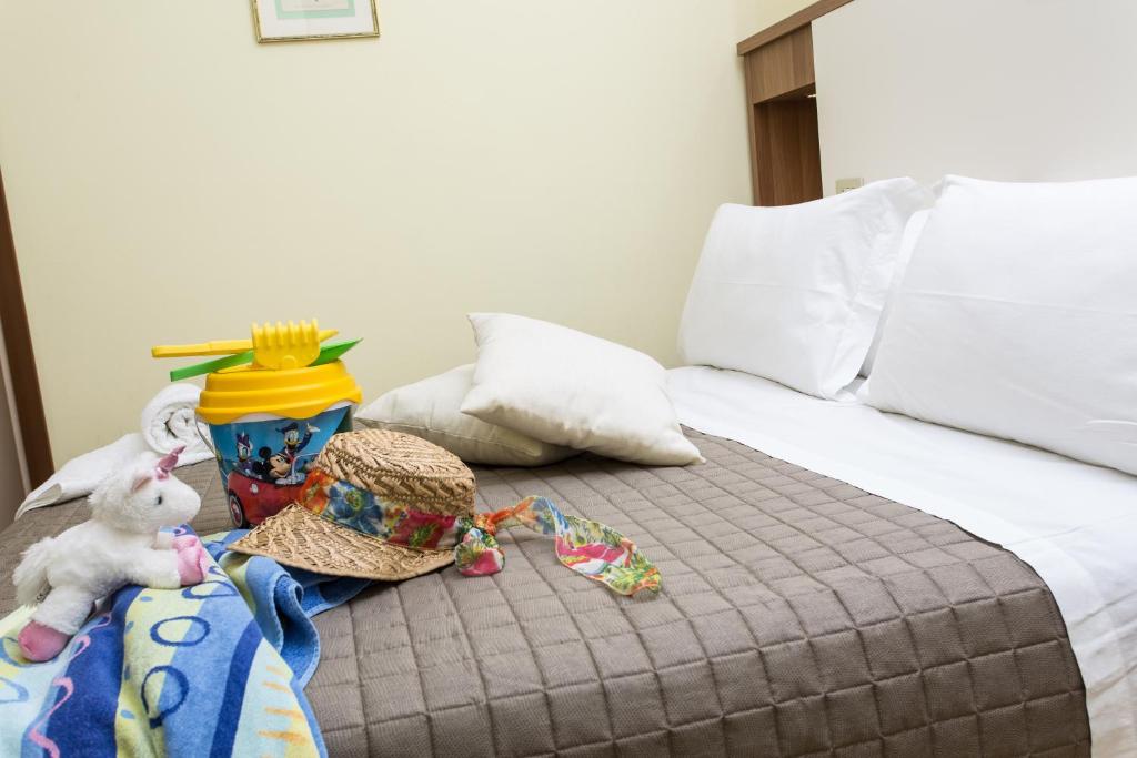 Postel nebo postele na pokoji v ubytování Hotel Valentino