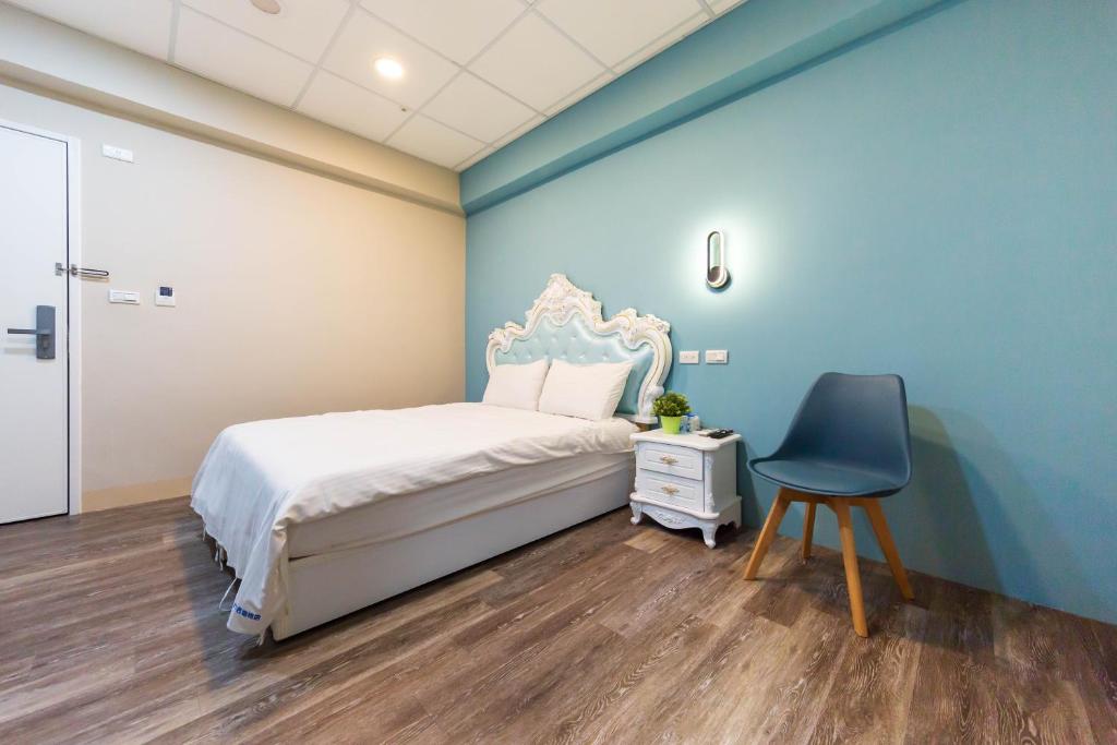 Postel nebo postele na pokoji v ubytování Liu He Su Hotel