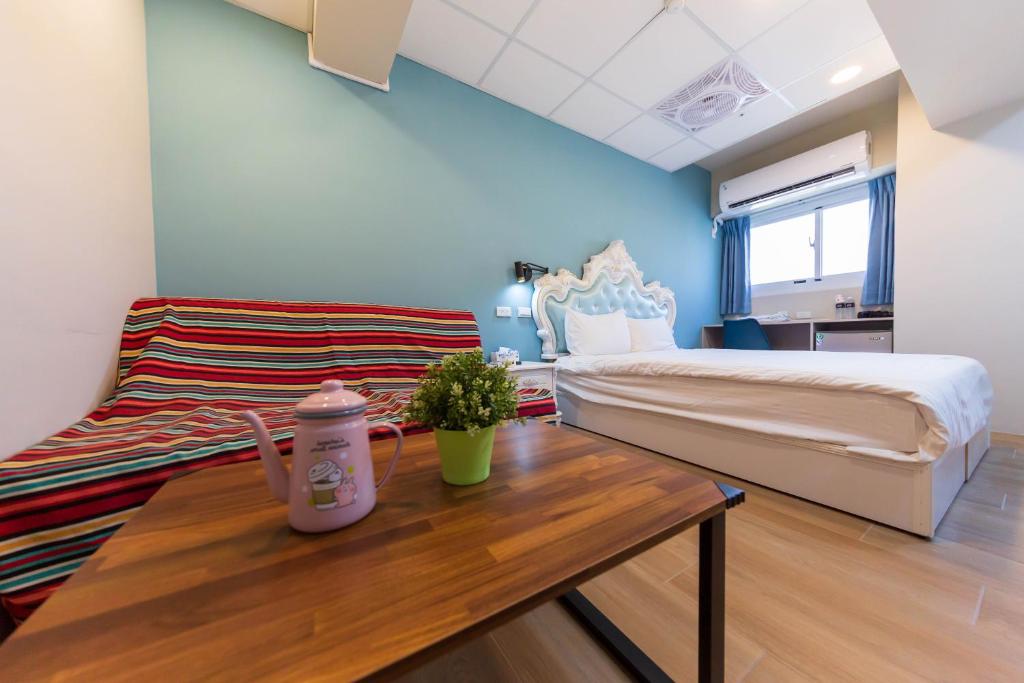 Postel nebo postele na pokoji v ubytování Liu He Su Hotel