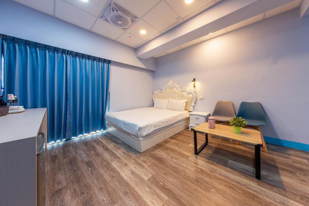 Postel nebo postele na pokoji v ubytování Liu He Su Hotel