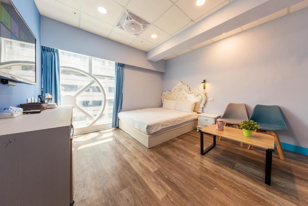 Postel nebo postele na pokoji v ubytování Liu He Su Hotel