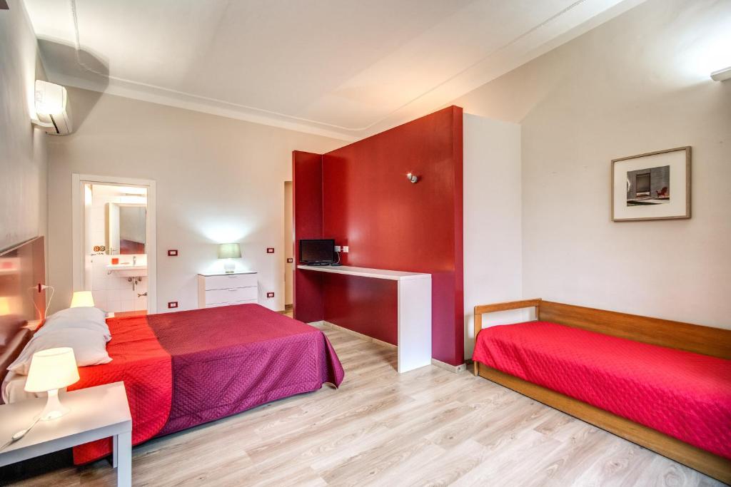 Posteľ alebo postele v izbe v ubytovaní Apartments Rione Trastevere XIII