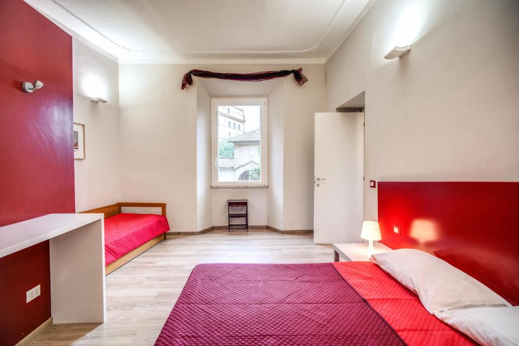 Posteľ alebo postele v izbe v ubytovaní Apartments Rione Trastevere XIII