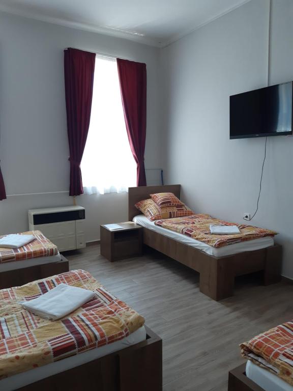 Postel nebo postele na pokoji v ubytování Helga Apartman