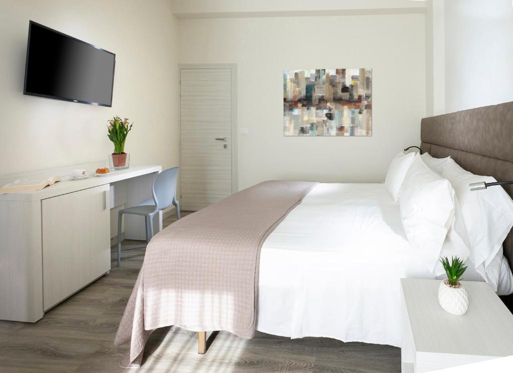 Postel nebo postele na pokoji v ubytování HOTEL ZANARINI in CENTRO a Riccione