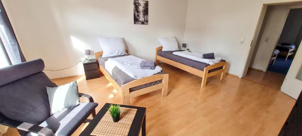 a living room with a couch and a table at Cozy 2 room flat with WLAN in Magdeburg