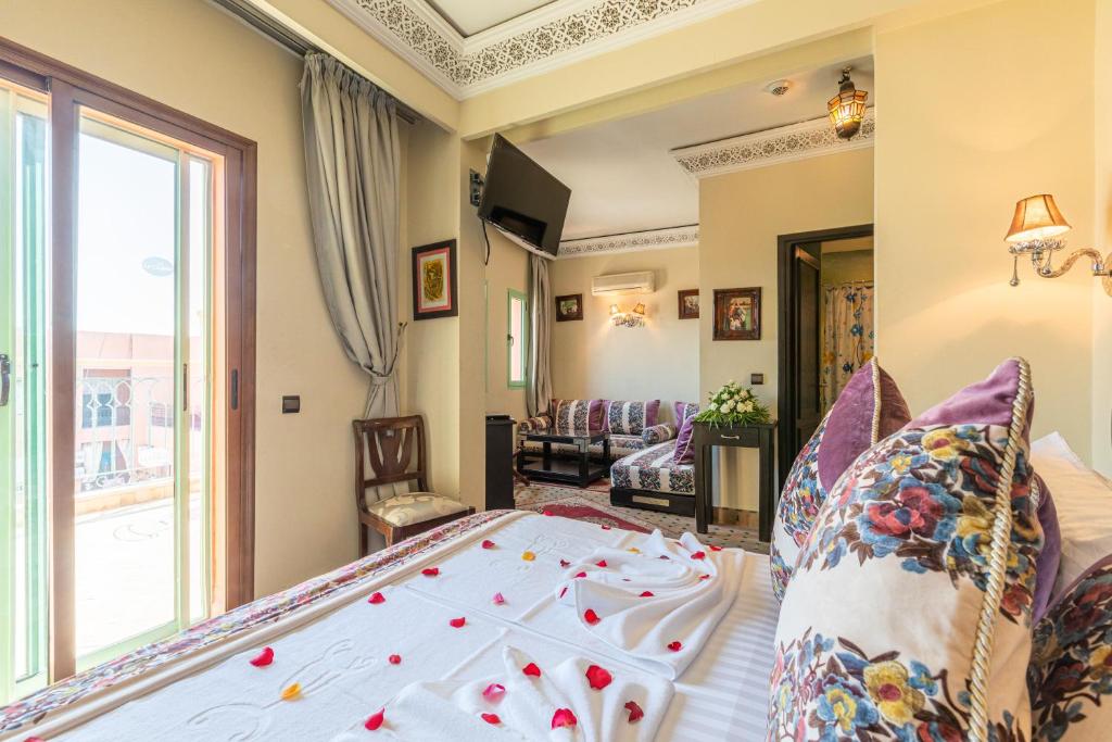 Postel nebo postele na pokoji v ubytování Le Caspien Boutique Hotel
