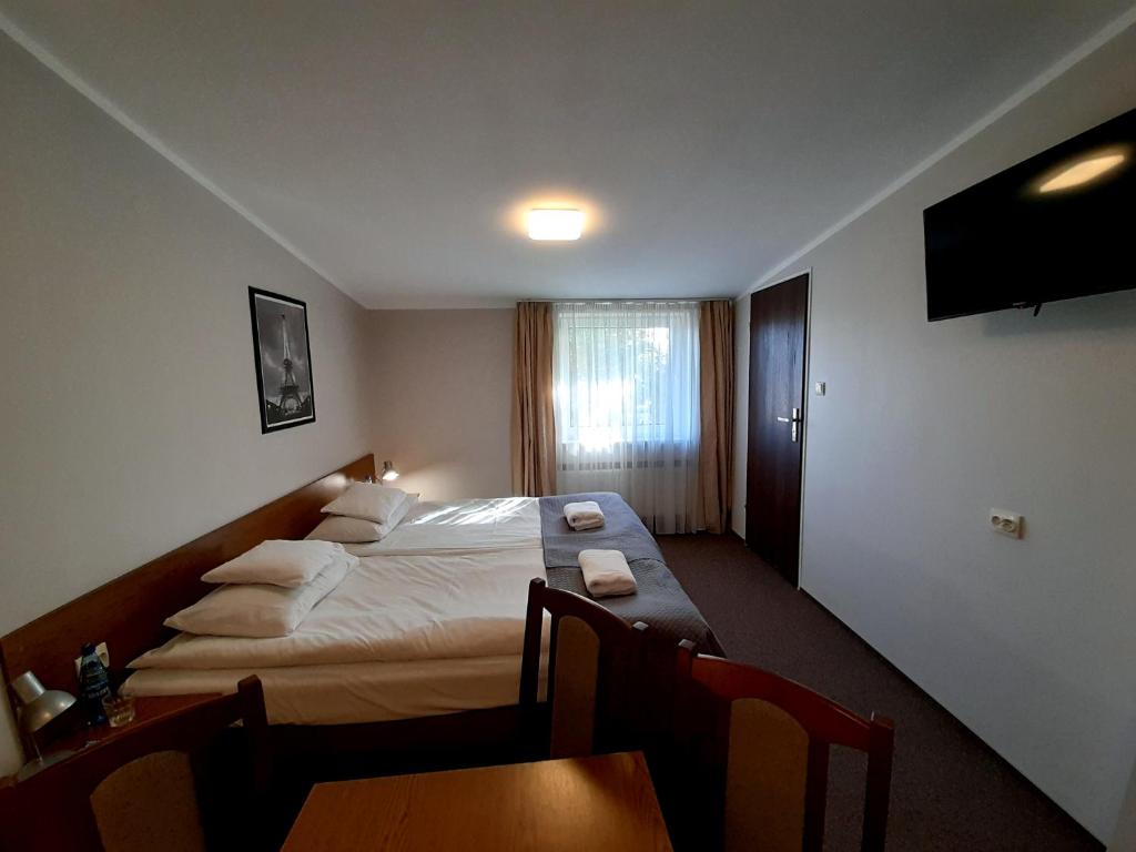 Postel nebo postele na pokoji v ubytování Astral