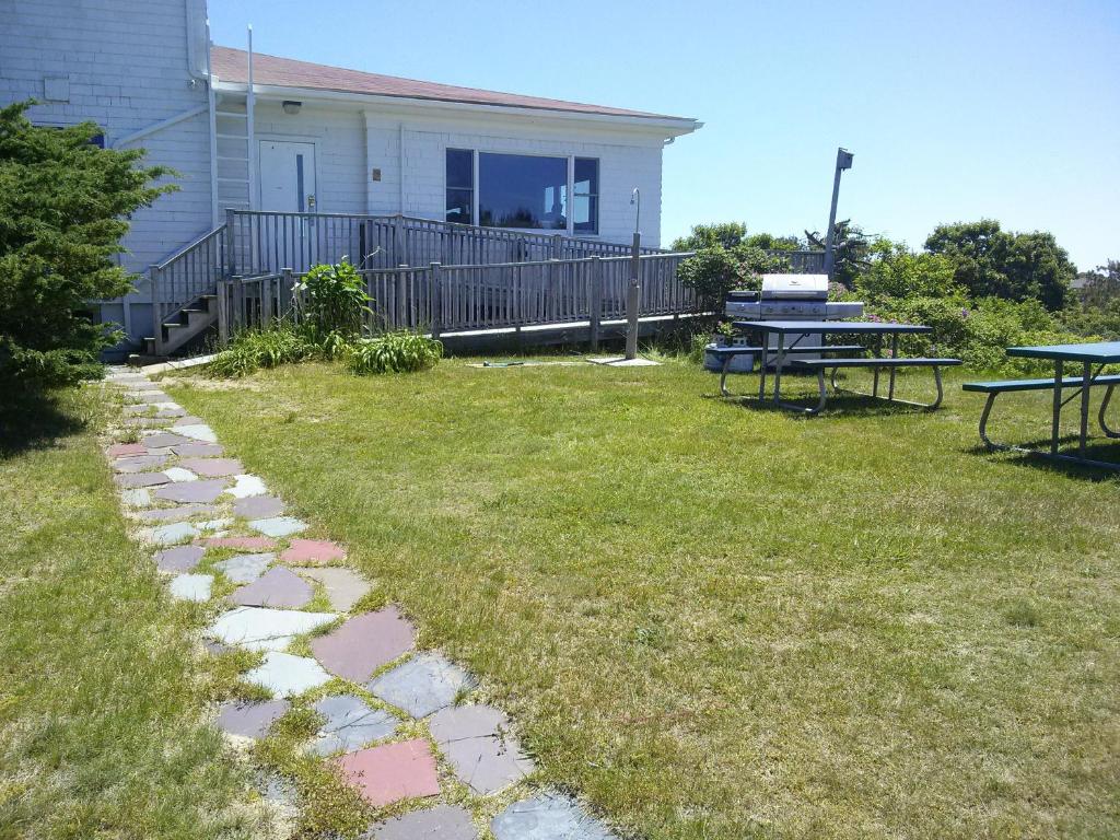 a backyard with a table and a picnic table at HI - Truro Hostel in Truro