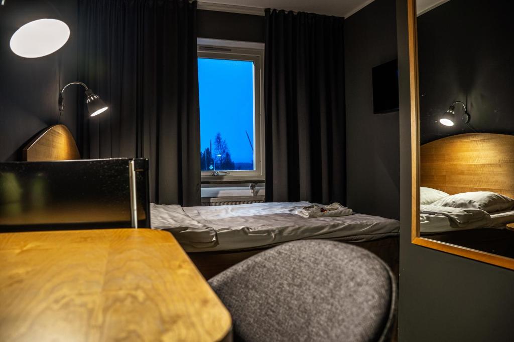 Postel nebo postele na pokoji v ubytování Hotel Lapland River