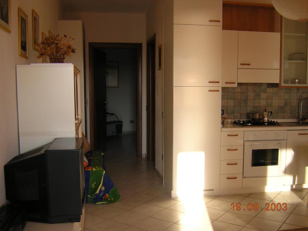 Kuchyňa alebo kuchynka v ubytovaní Porto Alabe Sardegna.... a due passi dal mare