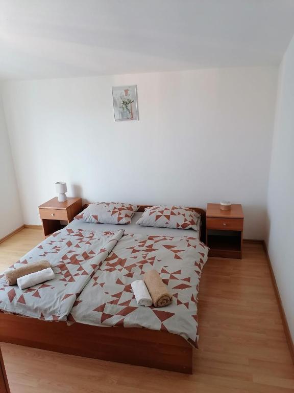 Postel nebo postele na pokoji v ubytování Apartments Zdenka