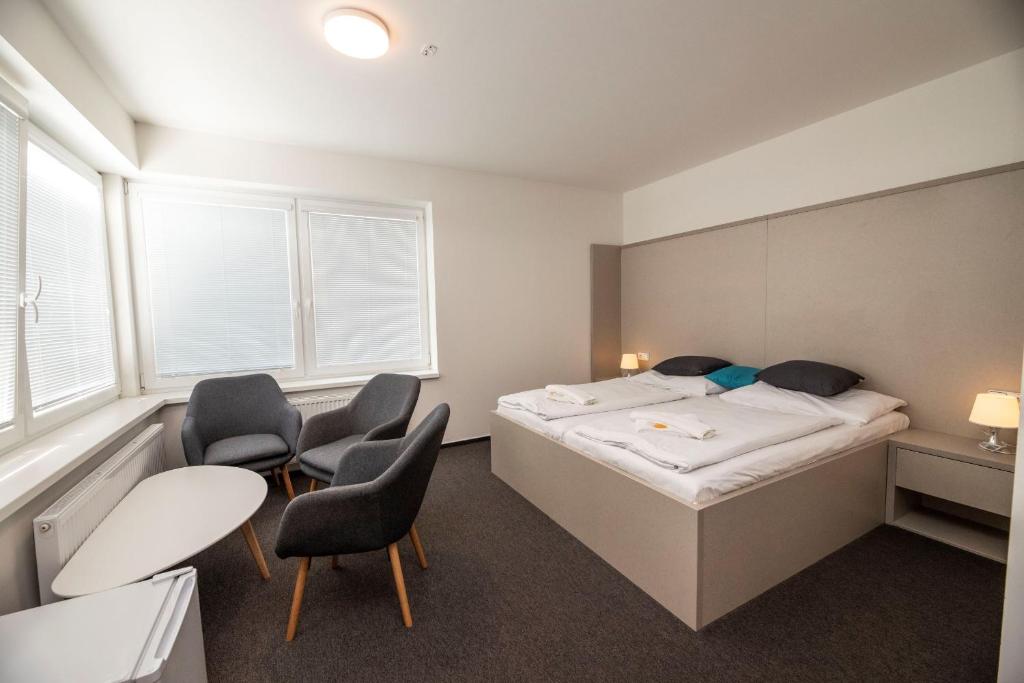 Postel nebo postele na pokoji v ubytování Hotel Rakovec