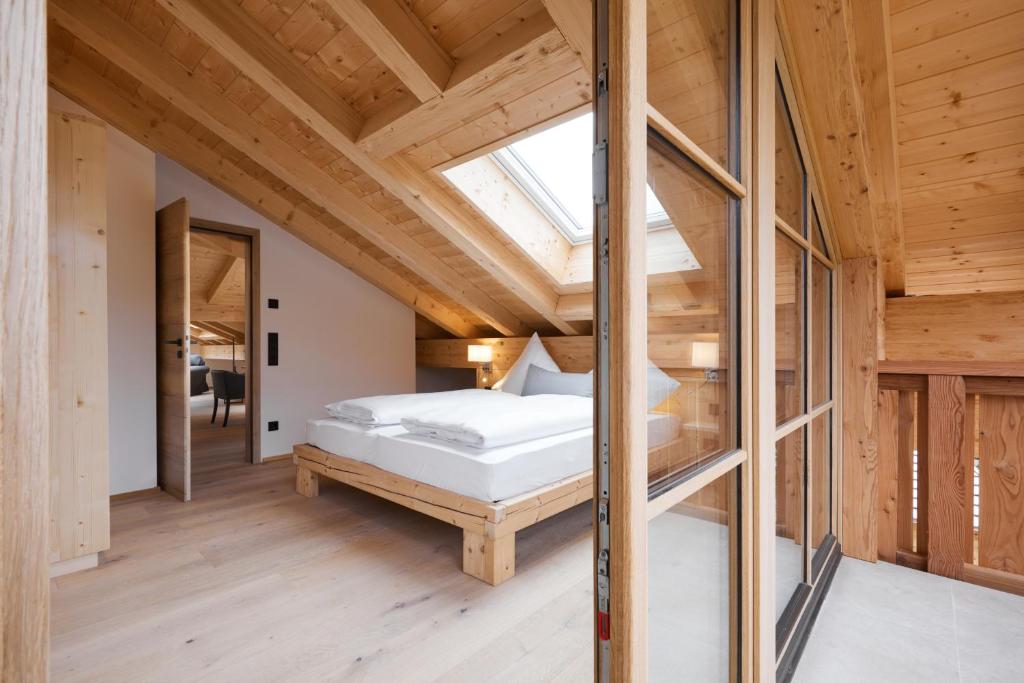 Postel nebo postele na pokoji v ubytování Zugspitzerei - Premium Chalet Ferienwohnungen