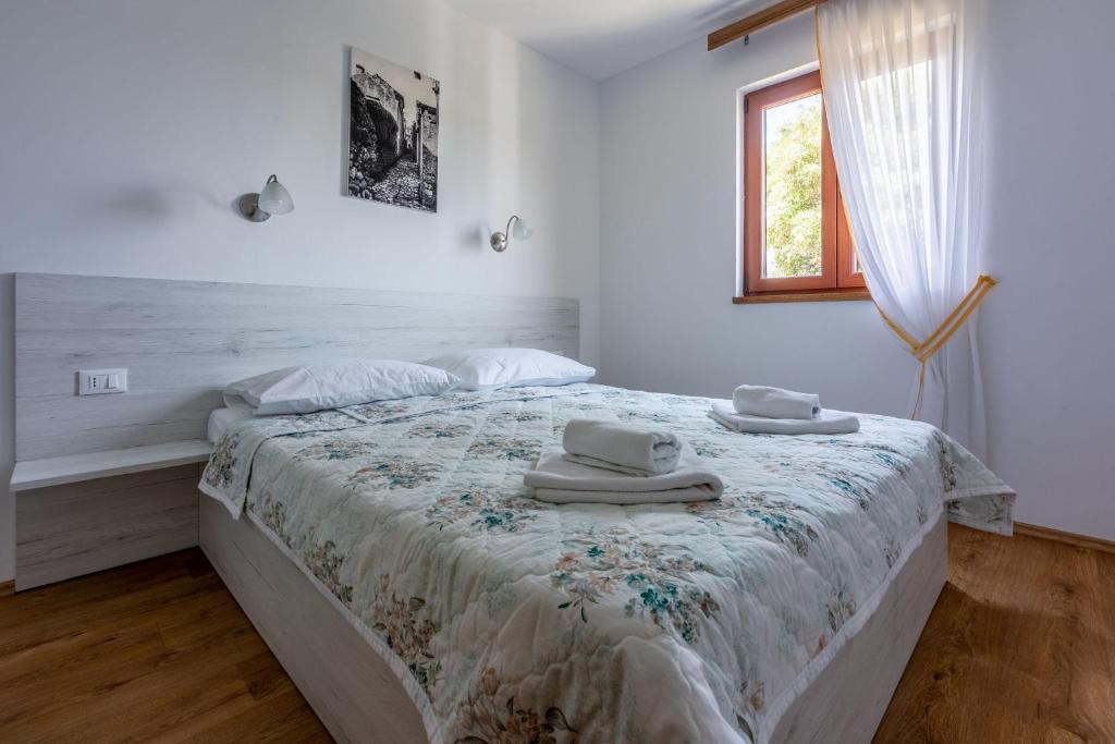 Postel nebo postele na pokoji v ubytování House Marija