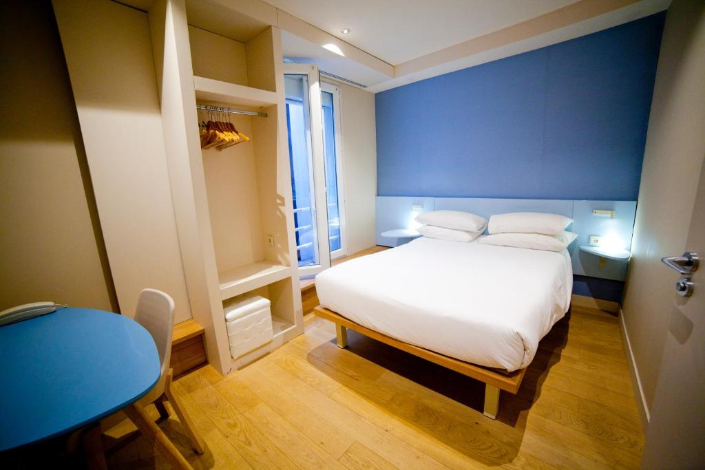 Una cama o camas en una habitaci&oacute;n de Hotel Andr&eacute;a