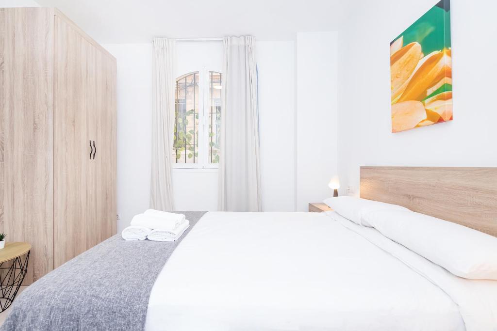 Postel nebo postele na pokoji v ubytování Lovely Victoria Apartament
