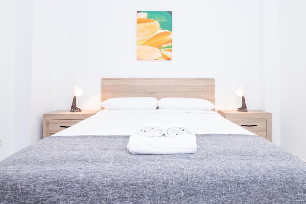 Postel nebo postele na pokoji v ubytování Lovely Victoria Apartament