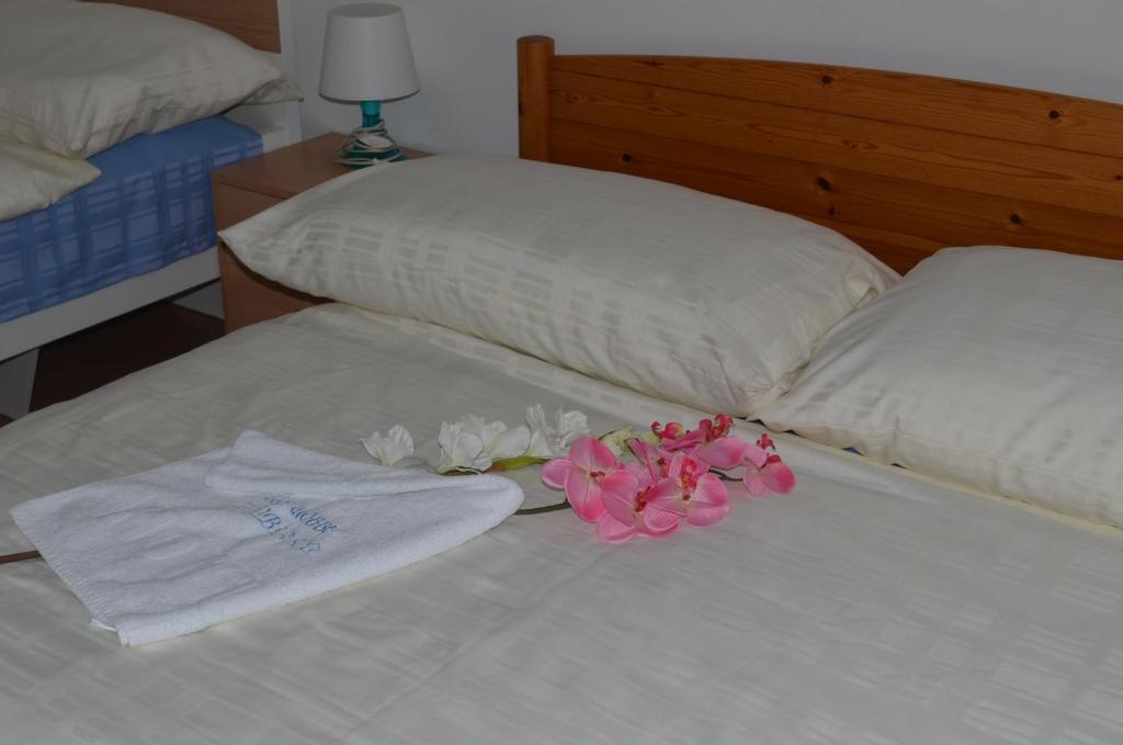 Postel nebo postele na pokoji v ubytování Hotel San Giobbe