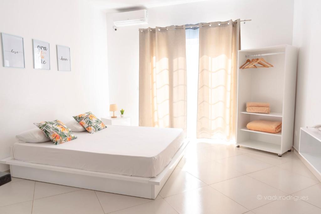 Postel nebo postele na pokoji v ubytování Urban Praia Maria - ApartHotel