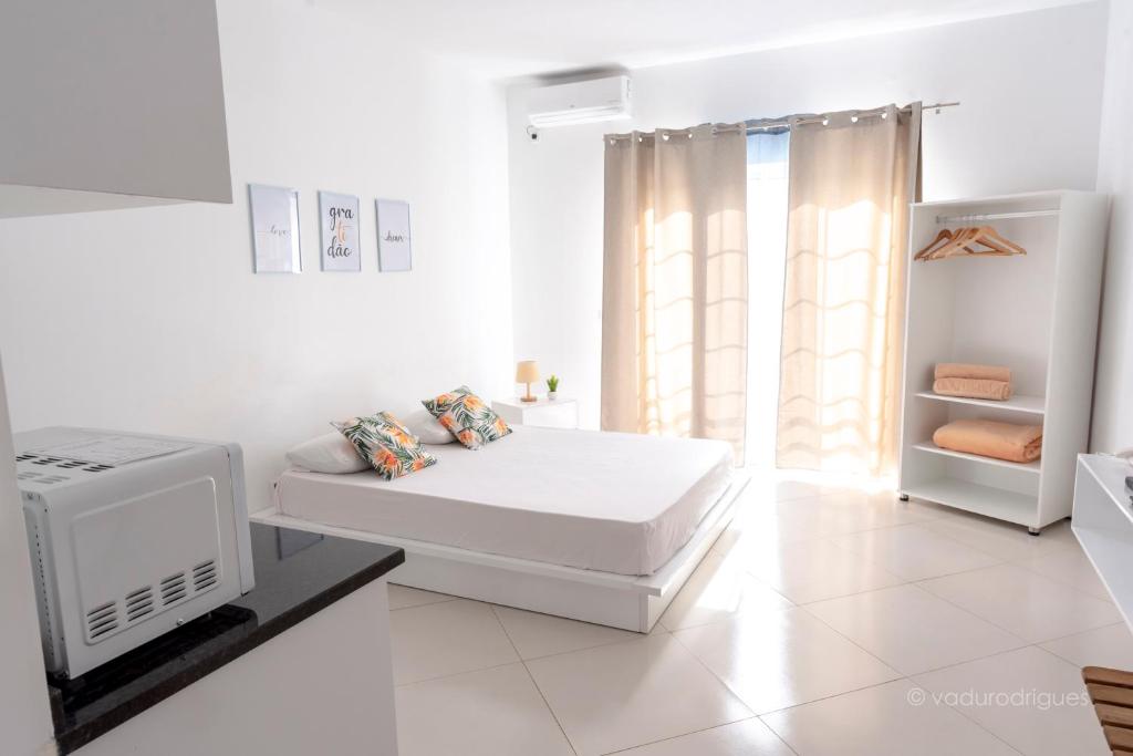 Postel nebo postele na pokoji v ubytování Urban Praia Maria - ApartHotel