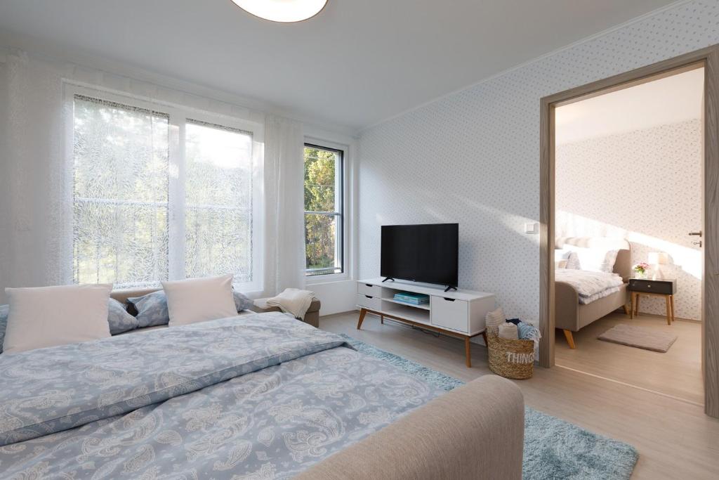 A bed or beds in a room at VeronikApartman - brand new & cozy - with underground garage