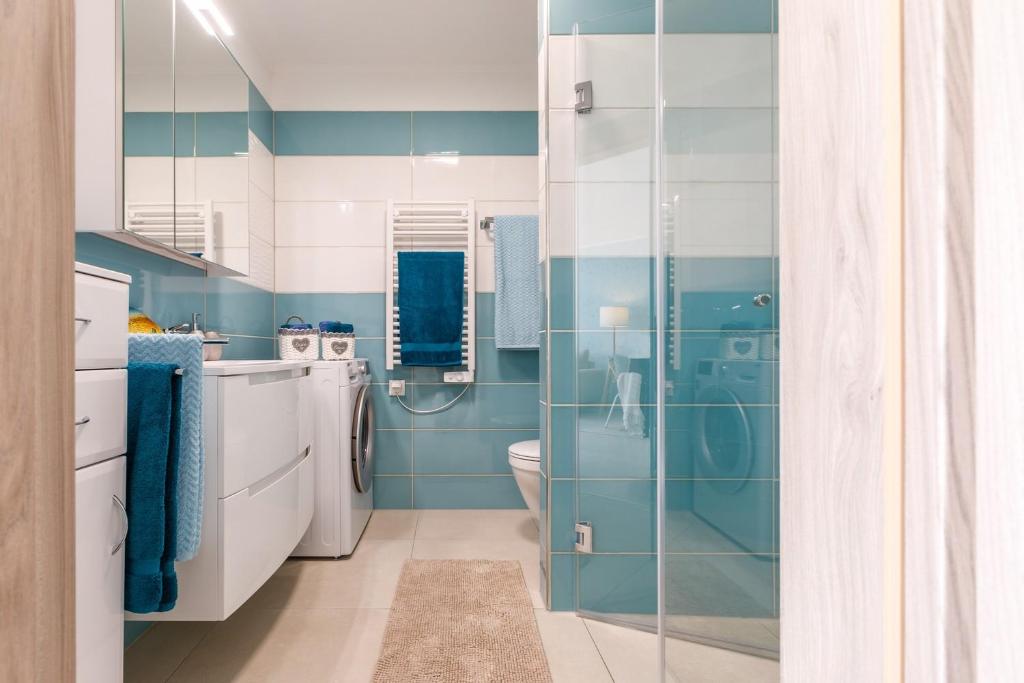 A bathroom at VeronikApartman - brand new & cozy - with underground garage