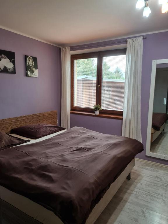 Postel nebo postele na pokoji v ubytování Vila MAX - WHIRLPOOL & BAZÉN & SAUNA