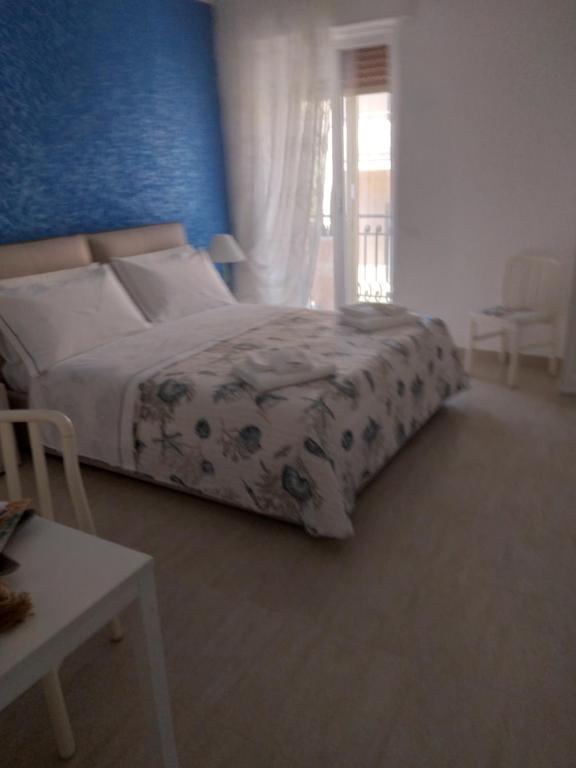 Postel nebo postele na pokoji v ubytování L'approdo