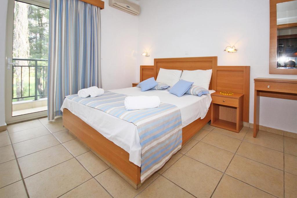 Postel nebo postele na pokoji v ubytování Miramare Hotel