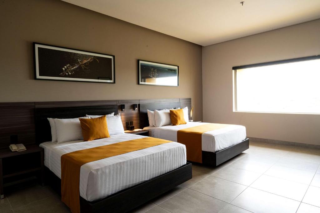 Postel nebo postele na pokoji v ubytování Best Western Plus Riviera Veracruz