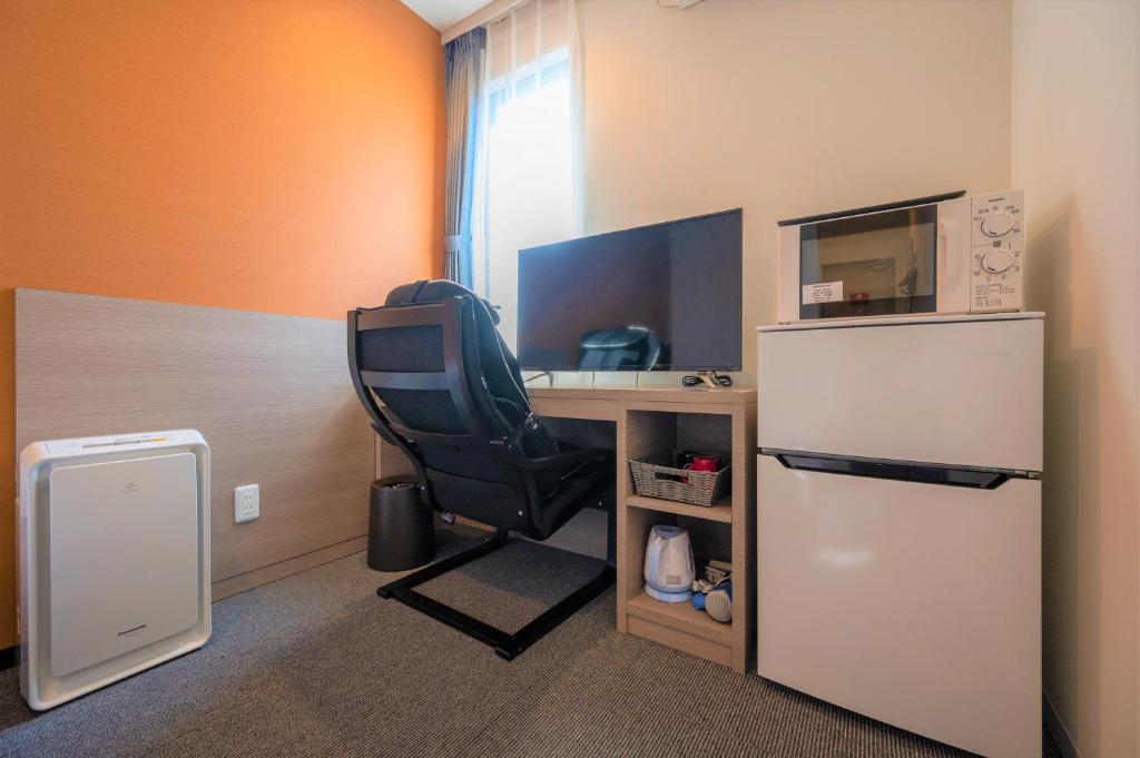 Kuchyň nebo kuchyňský kout v ubytování HOTEL R9 The Yard Hitachinaka