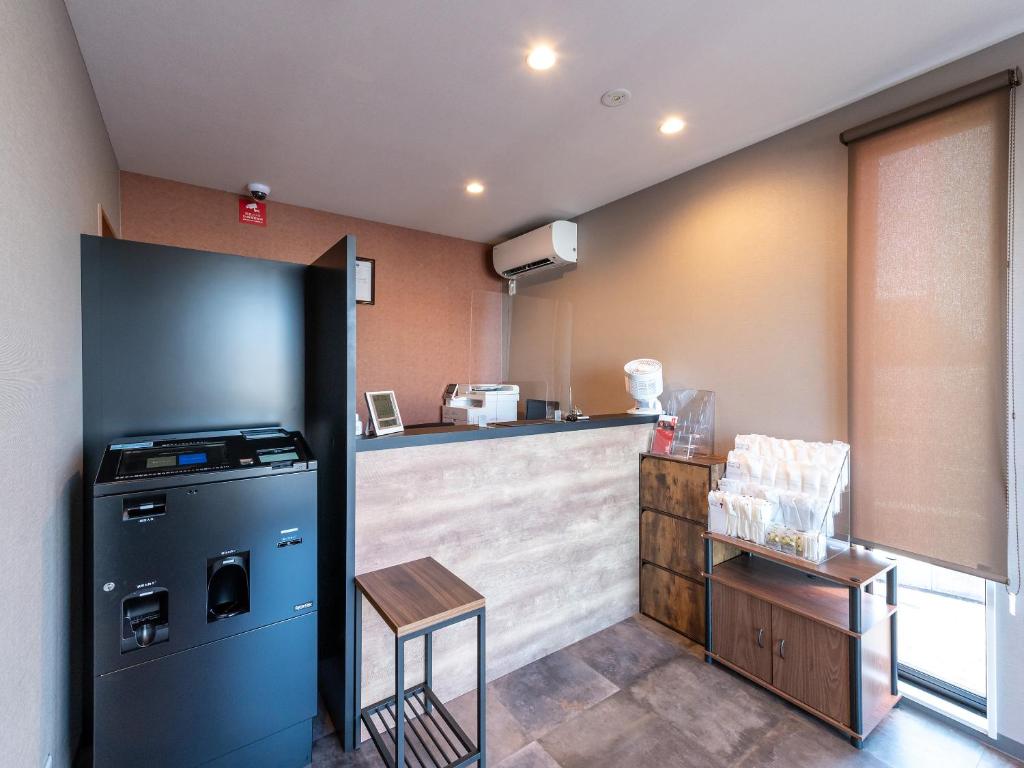 Kuchyň nebo kuchyňský kout v ubytování HOTEL R9 The Yard Hitachinaka