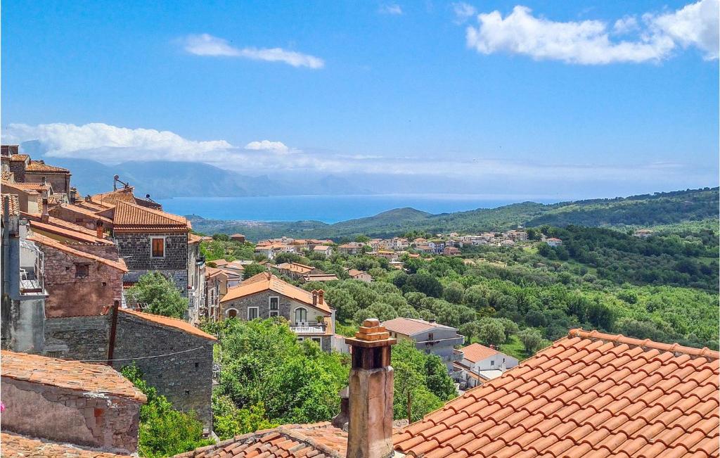 a view of a town with the ocean in the background at Lovely Home In Roccagloriosa With Kitchenette in Roccagloriosa