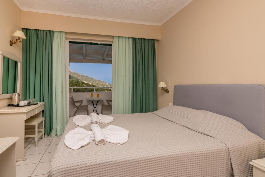 Postel nebo postele na pokoji v ubytování Matilda Hotel