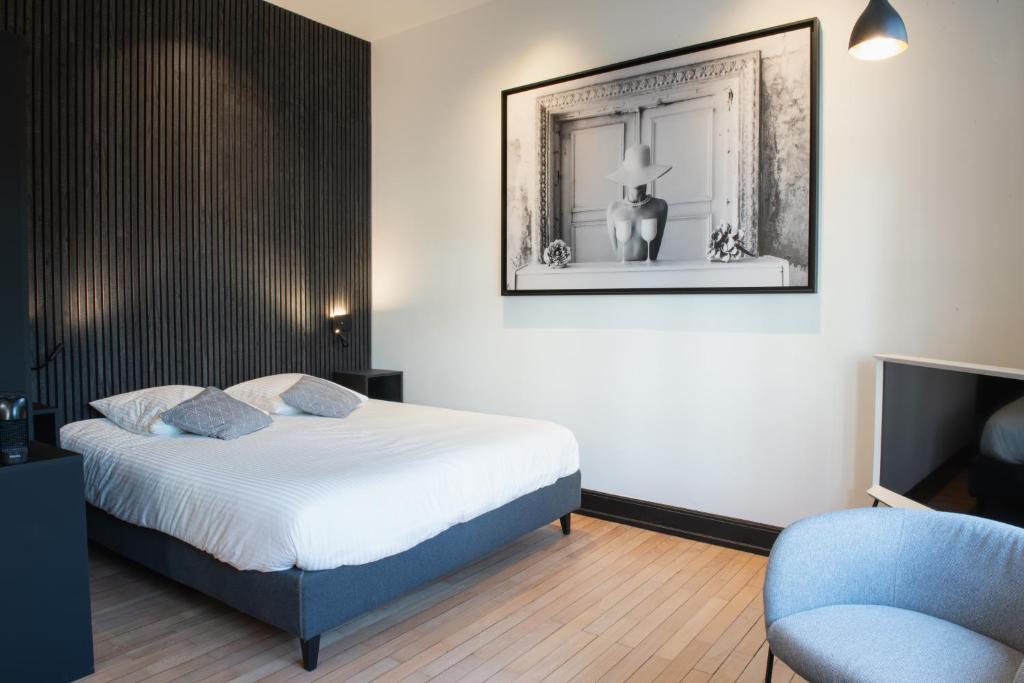 Postel nebo postele na pokoji v ubytování JAMES Résidence & Spa