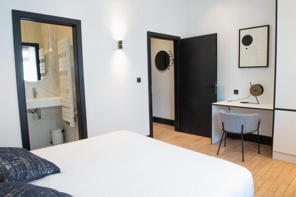 Postel nebo postele na pokoji v ubytování JAMES Résidence & Spa