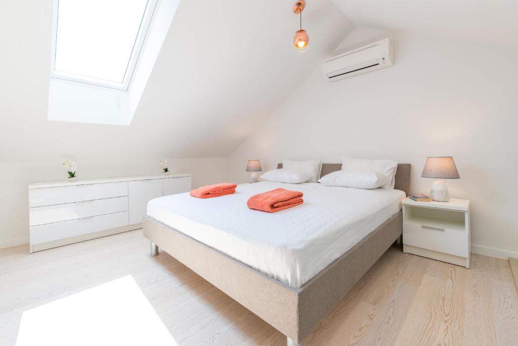 Postel nebo postele na pokoji v ubytování TopDeck Exclusive Apartment