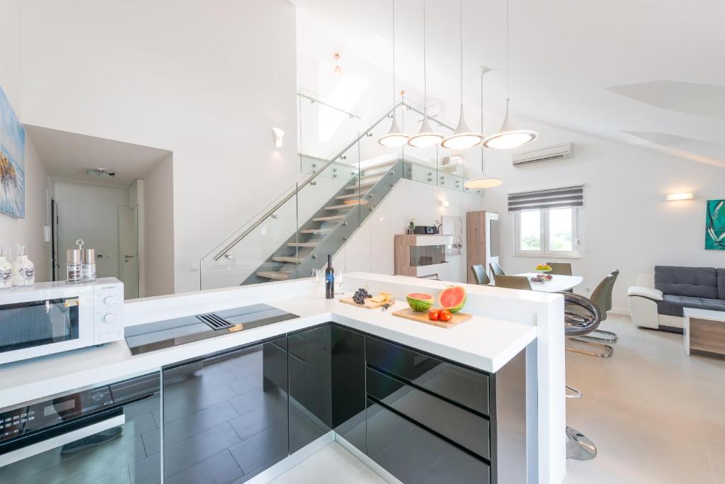 Kuchyň nebo kuchyňský kout v ubytování TopDeck Exclusive Apartment