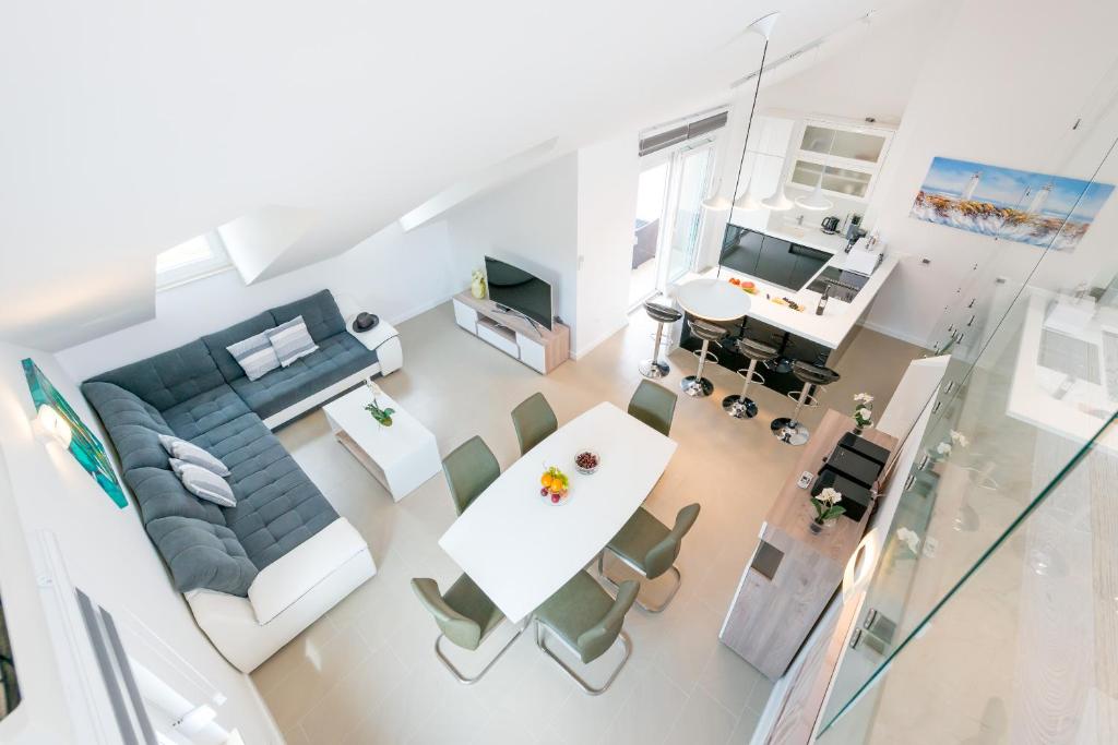 an overhead view of a living room and dining room at TopDeck Exclusive Apartment in Dubrovnik