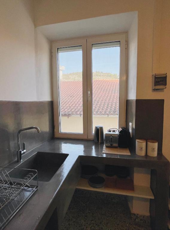 Kuchyň nebo kuchyňský kout v ubytování Dolce Vivere by Konnect, Gaios Paxos