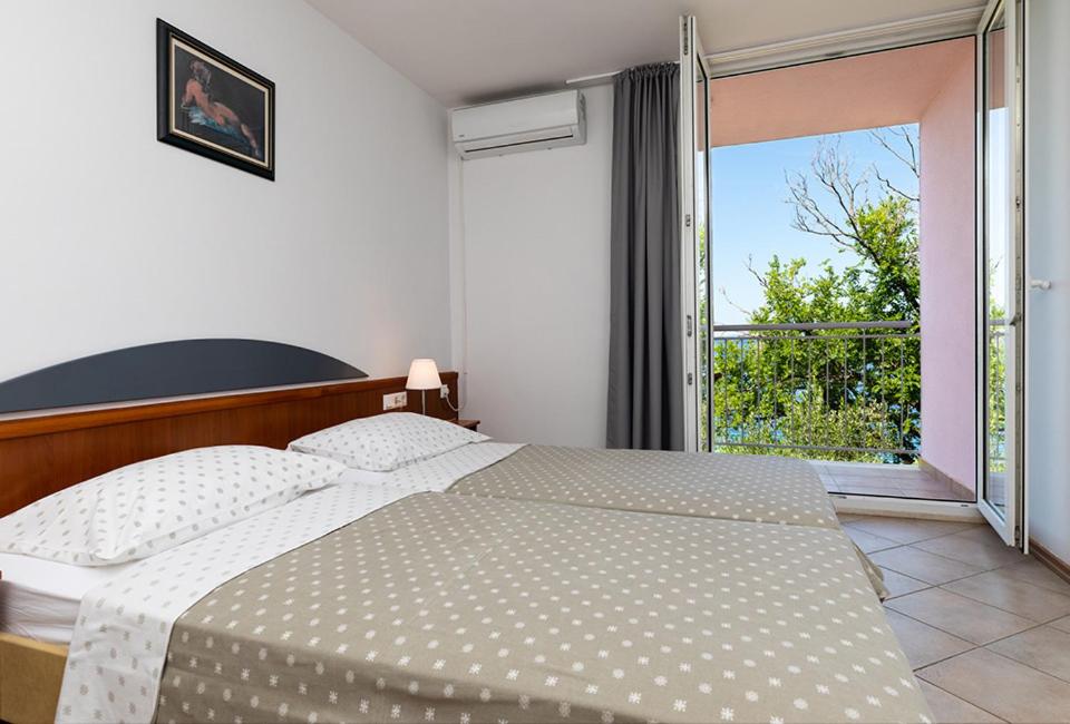 Postel nebo postele na pokoji v ubytování Tourist Settlement Brzet