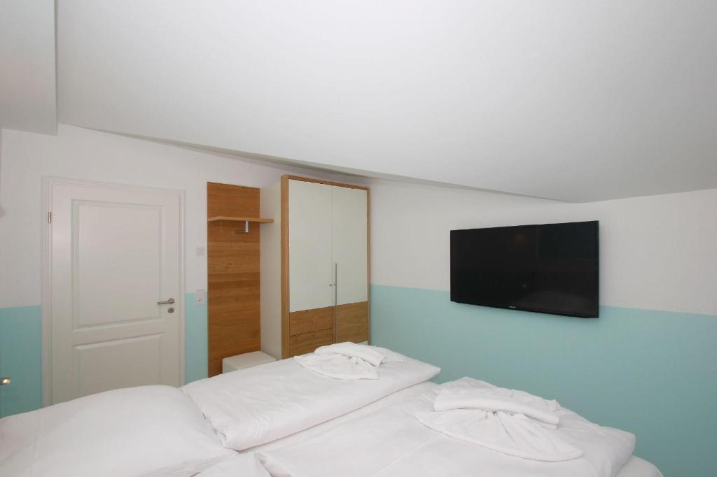 Postel nebo postele na pokoji v ubytování Meeresblick-Residenzen-FeWo-67-deluxe-Balkon-Meerblick-Sauna-u-Schwimmbadnutzung