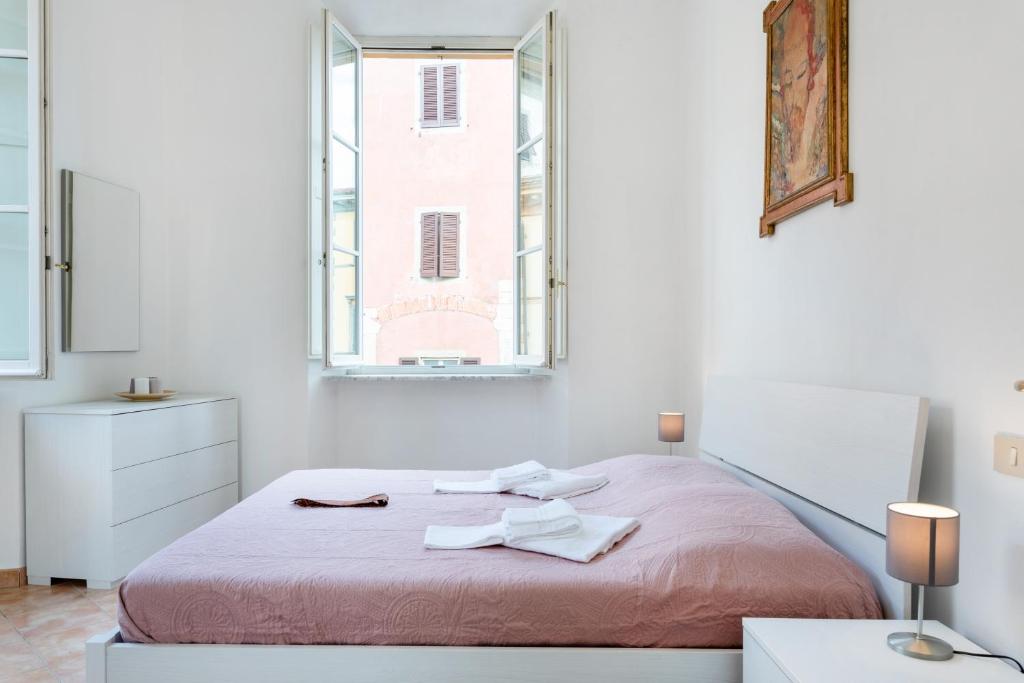 Łóżko lub łóżka w pokoju w obiekcie Borgo Stretto Bright Apartments