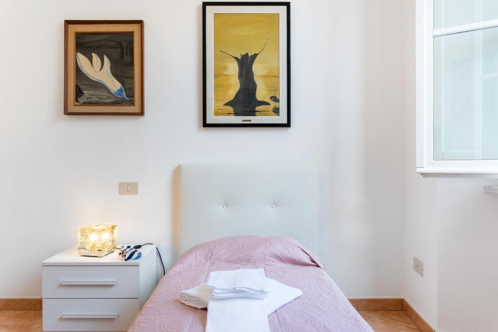 Łóżko lub łóżka w pokoju w obiekcie Borgo Stretto Bright Apartments