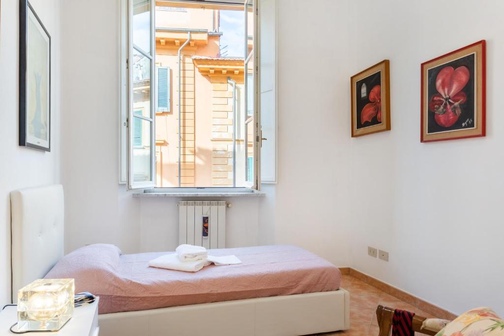 Łóżko lub łóżka w pokoju w obiekcie Borgo Stretto Bright Apartments