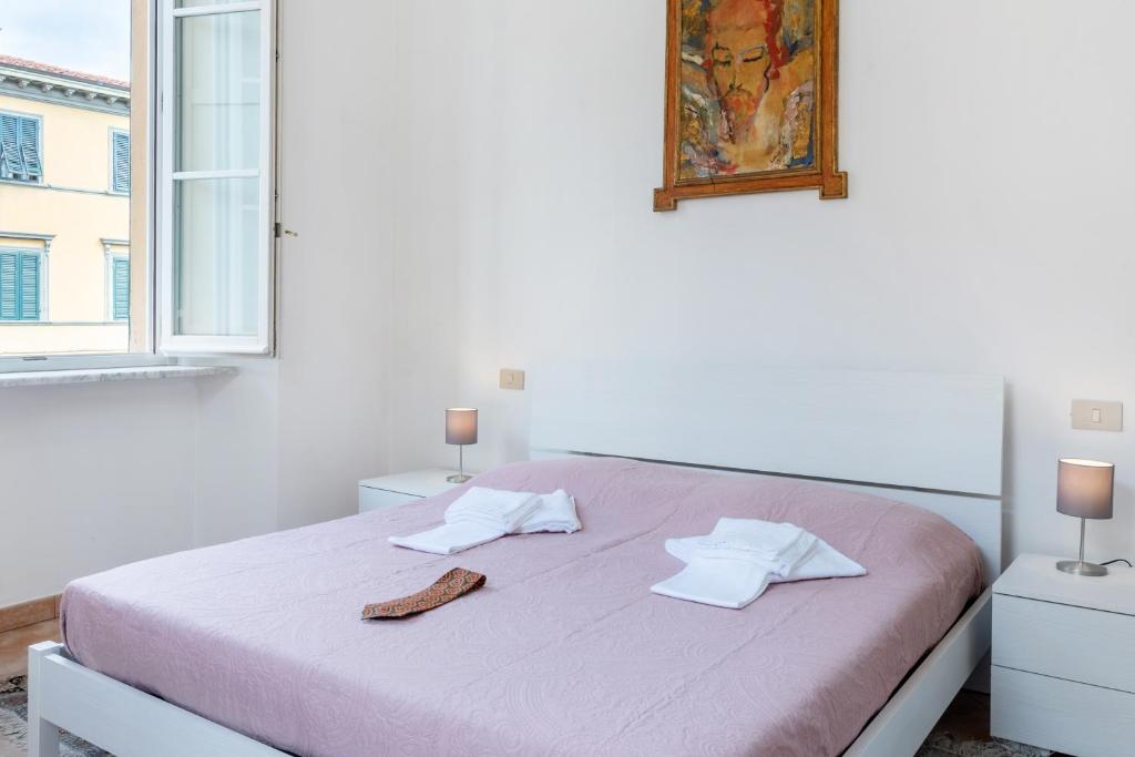 Łóżko lub łóżka w pokoju w obiekcie Borgo Stretto Bright Apartments