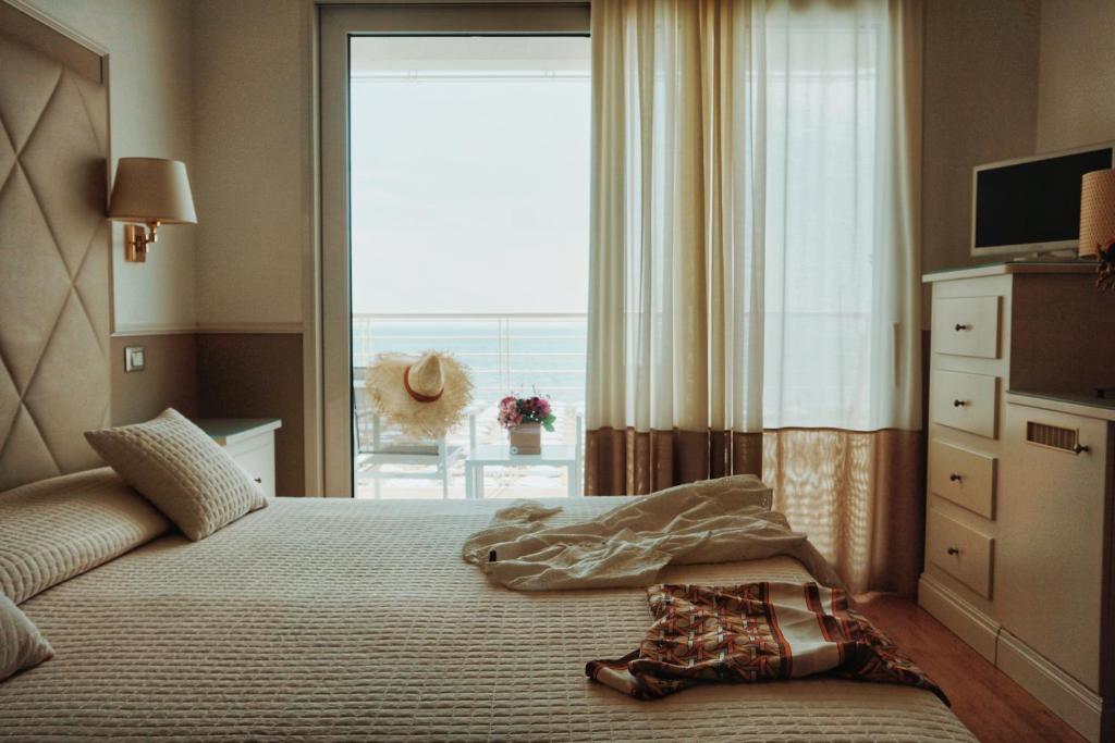 Postel nebo postele na pokoji v ubytování Hotel Le Soleil